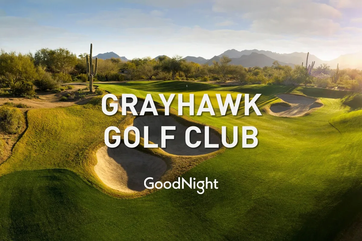 This image features a stunning golf course scene with well-manicured greens, sand traps, and a breathtaking mountain backdrop framed by cacti. The serene and luxurious setting conveys the experience of playing golf in the desert landscape.